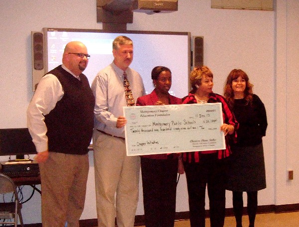 Accepting a $20,199 Chapter Initiative Grant from Stokes (c) in November are (l-r) Rod Sellers, Dunbar-Ramer School principal; Steve Blair, district technology instructor; Barbara Thompson, Montgomery Public Schools superintendent; and Debbie Webster, Goodwyn Middle School principal.
